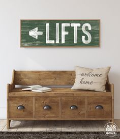 a wooden bench sitting in front of a wall with a sign above it that says lifts