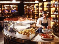 a man is preparing food in a restaurant