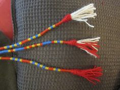 three colorful tassels on the back of a car seat