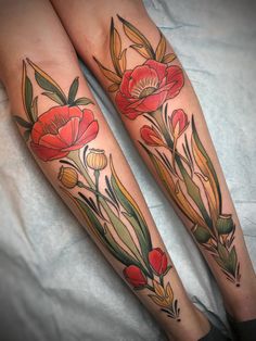 two legs with flowers and leaves on them