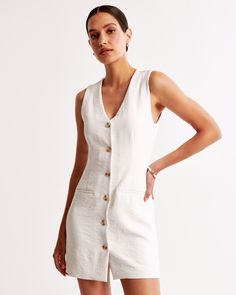 Elevate your wardrobe with the A&F Mara Vest Mini Dress, a chic ensemble perfect for any occasion. This dress features a flattering body-skimming silhouette crafted from premium crepe fabric. 

- Size: XL
- Color: Cream
- Material: Bodice lined with Polyester and Elastane
- Gender: Female
- Design: Features a button-through detail, non-functional front pockets, and a sleek v-neckline

Ideal for both daytime and evening wear, the Mara Vest Mini Dress combines functionality with fashion, ensuring Chic Mini Dress With Pockets For Daywear, Elegant V-neck Mini Dress With Pockets, Summer Workwear Mini Dress With Notched Neckline, Summer Mini Dress With Notched Neckline For Work, Fitted V-neck Dress With Button Closure, Knee-length, Fitted V-neck Dress With Pockets, White V-neck Mini Dress With Button Closure, Chic Summer V-neck Dress With Button Closure, Summer Workwear Dresses With Back Button Closure