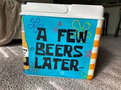 a cooler sitting on top of a carpet covered floor