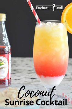 an orange and red drink sitting on top of a table