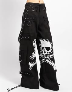 Accept no imitations! From the originator of all things DarkStreet, these black 'bad to the bones' pants feature removable straps, adjustable ankles, D-rings, and deep pockets with printed skull graphics inbetween the legs. WOMAN IS WEARING X-SMALLMAN IS WEARING MEDIUMSIZING BASED ON MENS FIT– Refer to Unisex Darkstreet Pant - Size Chart (Based on Men's Sizing)– Drawstring and adjustable waist buckles allow for a tighter fit on the waist– 100% Cotton.– Hand wash cold. Lay flat to dry. Skull Pant, Trip Pants, Emo Pants, Alt Style Outfit, Skull Pants, Goth Pants, Tripp Pants, Cool Pants, Gothic Pants