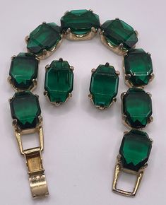 Collectible jewelry. Check out the store's reduced prices.  Now listed is Stunning Dark Emerald Green Emerald Cut Vintage Bracelet & Pair of Earrings May Birthstone Set High End Designer Pair the Perfect Bling! This set is FABULOUS and has stood the test of time and is still a beauty to wear now.  The stones are clear, the photo booth caused the striped look in the stones. These pieces of exquisite candy accessories will adorn you, and accessorize any outfit. Picture a solid white outfit, with t Candy Accessories, Dark Emerald Green, Green Jewelry, White Outfit, May Birthstone, Vintage Bracelet, Bracelet Vintage, Holiday Jewelry, Green Emerald