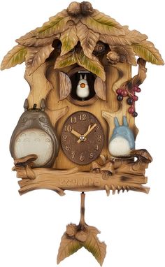 a wooden cuckoo clock with two birds on it