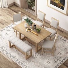 a dining room table with four chairs and a bench in front of it on top of a rug