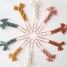 several different colored knitted hair pins arranged in a circle