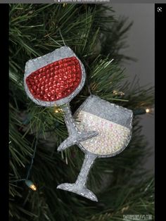 an ornament shaped like a wine glass hanging from a christmas tree