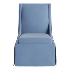 a blue upholstered chair with an open back and foot rest on the side