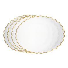 four white and gold scalloped placemats