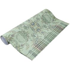 a set of four placemats on top of each other with paisley designs in green