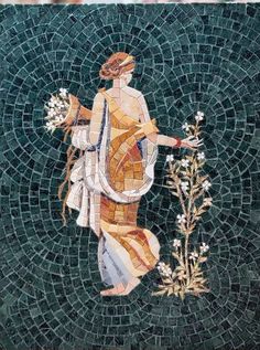 a mosaic with a woman and flowers on it