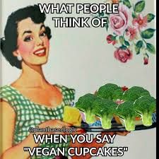 a woman holding a plate with broccoli on it and the caption says, what people think of when you say vegan cupcakes