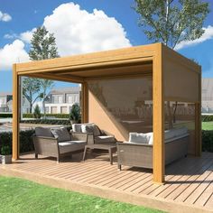 an outdoor living area with couches and chairs under a pergolated roof on a deck