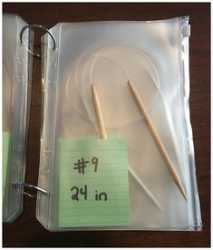 there are two knitting needles in a plastic case