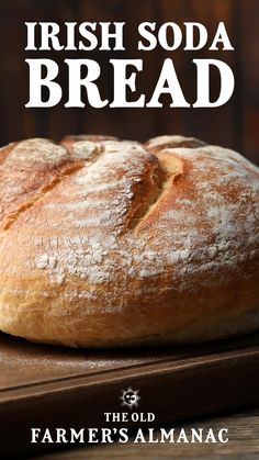 a loaf of bread sitting on top of a cutting board with the words irish soda bread