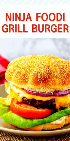 a grilled cheeseburger with lettuce, tomato and onion on a plate