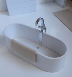 a white sink sitting on top of a counter