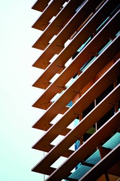 the side of a tall building with lots of balconies on it's sides