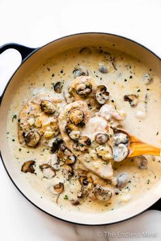 a skillet filled with chicken and mushroom soup