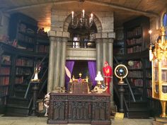 a room filled with lots of books and furniture