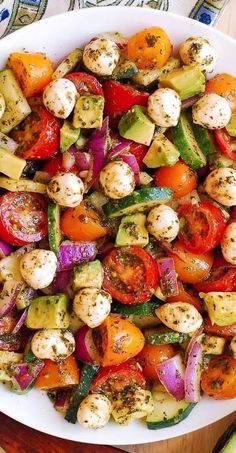 a white plate topped with lots of veggies