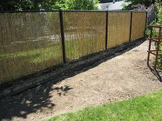 a fence that is next to some grass