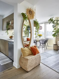 a living room filled with furniture and a large mirror