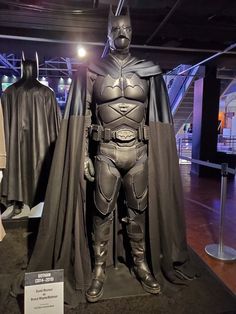 a batman costume on display in a museum