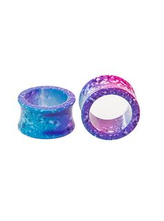 two purple and blue glass rings on a white background with space in the top right corner