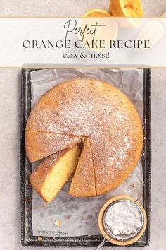 an orange cake is cut into slices and served on a tray with powdered sugar