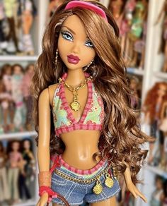 a close up of a barbie doll with many dolls in the backgroung