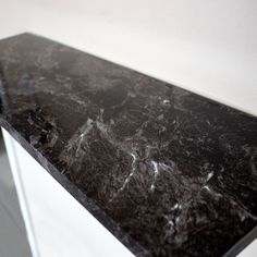 a black and white marble counter top in a room