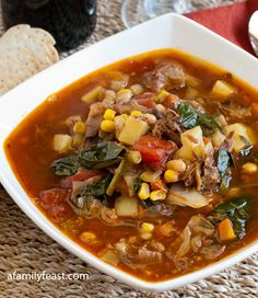 a white bowl filled with soup and vegetables