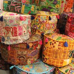 many colorful baskets stacked on top of each other