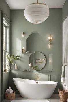 a white bath tub sitting under a bathroom mirror