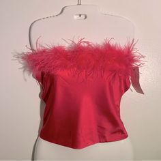 Pink Feathered Top With A Corset Style #90s #Y2k This American Threads Women's Top Is A Stylish Addition To Your Wardrobe. The Sleeveless Design And Halter Neckline Make It Perfect For A Party Or Cocktail Occasion. The Top Features A Tie Closure And Is Made Of A Polyester And Spandex Blend With A Satin Fabric Type. The Solid Pink Color And Feather Accents Add A Touch Of Elegance To The Cropped Style. This Top Is A Size Small. The American Threads Brand Is Known For Quality And This Top Is No Exc Pink Fitted Tops For Party Season, Pink Feather Top, American Threads, Feather Tops, Pink Feathers, Corset Style, Cropped Style, Halter Neckline, Themed Party