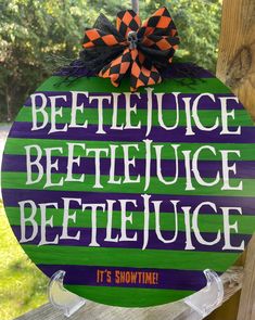 a wooden sign that says beetle juice betlejuce bejeice it's showtime