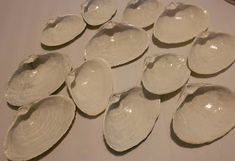 white ceramic spoons sitting on top of a table