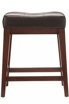 the backless stool is made from wood and has a brown leather cushion on it