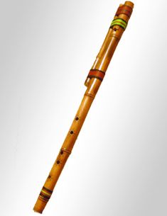 a wooden flute with green and red stripes