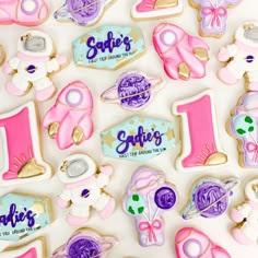 some decorated cookies with the number one on them for a first birthday party or baby's first birthday