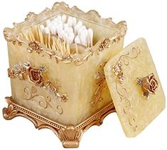 a decorative box with toothbrushes in it