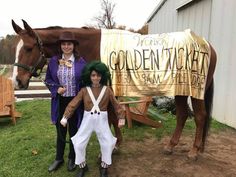 two people in costumes standing next to a horse