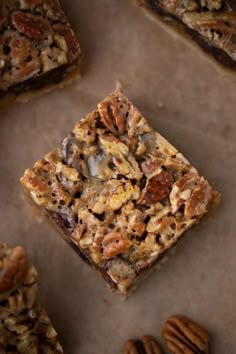 pecan bars with nuts and chocolate on top