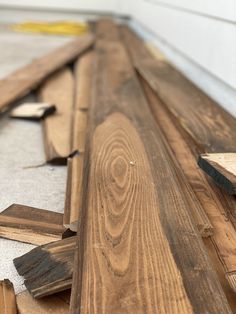 wood planks laid out on the floor to be sanded