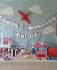 an airplane themed birthday party with cake and decorations