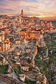 an aerial view of a city at sunset