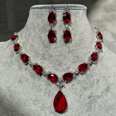 Handmade  Style: Necklace and Earrings Set Material: Platinum Plated, Lab Simulated Ruby and White Sapphire Stones Imported Size: Earrings measure 1.60 inches long. Please Note: This necklace and earrings are sold as a set. Item Number: 7074R Red Diamond Jewelry Set, Red Prom Necklace, Red Jewel Necklace, Red Jewelry Aesthetic, Red Diamond Jewelry, Red Jewelry Necklace, Ruby Stone Necklace, Ruby Jewelry Set, Necklace Stacks